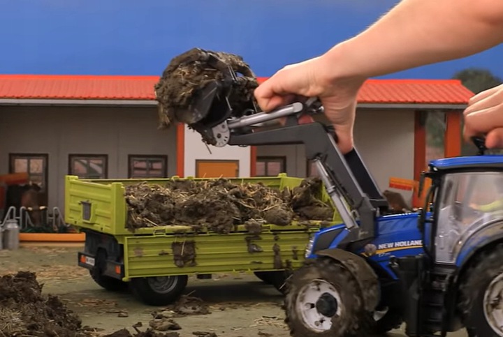 BRUDER-03121 <br>CIĄGNIK NEW HOLLAND T7.315 Z ŁADOWACZEM